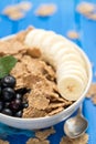 Flakes with blueberries and banana on brown bowl Royalty Free Stock Photo