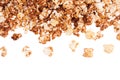 Flakes chocolate popcorn flying on white background, top view, isolated.