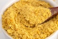 Flakes of Yellow Nutritional Yeast a Cheese Substitute and Seasoning for Vegan Diets Royalty Free Stock Photo