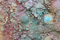 Flaking colored layers of paint on a metal surface Royalty Free Stock Photo