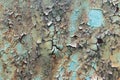 Flaking paint from the metal surface