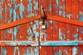 Flaking paint on old wooden planks of locked door Royalty Free Stock Photo