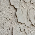 Flaking plaster or paint in a light beige color. The texture Royalty Free Stock Photo