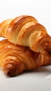 Flaky, buttery croissants showcased on a clean, bright white background
