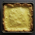 Flaky layers unfolding from a golden brown rectangle, buttermilk, cooling rack Royalty Free Stock Photo