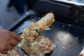 Flaky scallion pancake. Taiwan`s popular breakfast. Chef cooking Flaky scallion pancake menu. Asian street food. Royalty Free Stock Photo