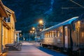 Flam, Norway. Famous Railroad Flamsbahn. Green Norwegian Train Near Railway Station