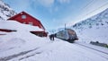 The train stops at the flam station. The Flam Line is between Myrdal and Flam in Aurland, Norway, the mainline of the Bergen Line.