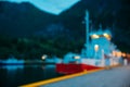 Flam, Norway. Touristic Ship Boat Moored Near Berth In Sognefjord Port. Summer Evening. Abstract Boke Bokeh Background Royalty Free Stock Photo