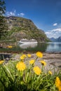 Flam village with ship in harbor against fjord during spring time, Norway Royalty Free Stock Photo