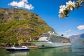 Flam village with ship in harbor against fjord during spring time, Norway Royalty Free Stock Photo