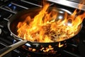 Flambe-cooking procedure in wich alcohol is added to a hot pan to create a burst of flames Royalty Free Stock Photo