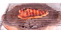 Flame broiled steak on a grill Royalty Free Stock Photo