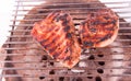 Flame broiled steak on a grill