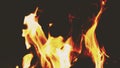 Flame, burning close-up. View of essence of fire due to slow motion of flames.