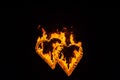 Flame-burning silhouettes of the heart. Royalty Free Stock Photo