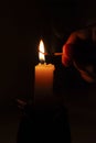 Flame of candle, matchstick and finger in the dark Royalty Free Stock Photo