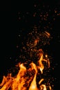 Flame of fire with sparks in the air over a dark night Royalty Free Stock Photo