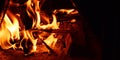 Flame and firewood burning Royalty Free Stock Photo