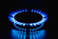 Flame of a gas burner on a black background. Combustion of Natural gas on a black background. Gas stove. Gas stove burner on fire