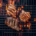 Flame grilled beef and chicken steaks on the barbecue