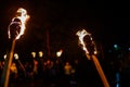 Flame on a homemade torch, fire on the background of night streets, peaceful actions with torches Royalty Free Stock Photo