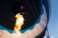 Flame inflating hot air balloon Royalty Free Stock Photo