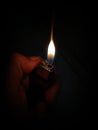 the flame from a lighter when lit in the dark of night Royalty Free Stock Photo