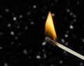 Flame match snow snowfall in the cold winter night background