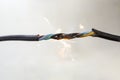 flame smoke and sparks on an electrical cable, fire hazard concept Royalty Free Stock Photo