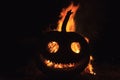 Flame that is visible through the eyes and mouth of the pumpkin`s head