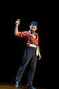 Flamenco artist\'s graceful gesture on stage, copy space