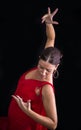 Flamenco dancer backs red dress and hands crossed up on his back