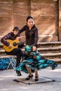 Flamenco dancer in motion and guitarist