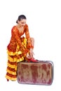 Flamenco dancer putting on red shoe on suitcase Royalty Free Stock Photo