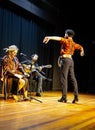 Flamenco ensemble: dancer leading performance with musicians, copy space Royalty Free Stock Photo