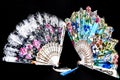 Flamenco hand fan with colorful pattern isolated on black background Royalty Free Stock Photo