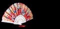 Flamenco hand fans with colorful pattern isolated on black background. Spanish or Chinese influence