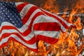 Flames burning home during the destroyed homes and the American Flag Royalty Free Stock Photo