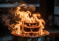 Flames engulf a stack of three metal rings placed on a circular platform Royalty Free Stock Photo