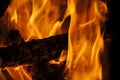 Trunk burning in the fireplace with large flames Royalty Free Stock Photo