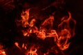 Flames in an outdoor fire pit at night Royalty Free Stock Photo
