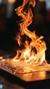 Flames rising from a burning sheet of paper, dramatic close-up. Fire and destruction concept Royalty Free Stock Photo