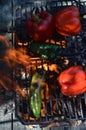 Flames smoke peppers on hibachi grill outdoors Royalty Free Stock Photo