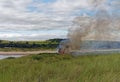 Flames and smoke from a Wildfire in the Gorse and Grasses behind the Dunes of Montrose Beach