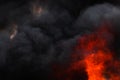 Flames strong red industrial fire, dramatic clouds of black smoke covered sky Royalty Free Stock Photo