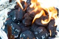 Flaming BBQ briquettes Royalty Free Stock Photo