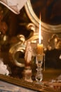 Flaming candle in the church near the figure of the mother of God. Catholicism, the concept of Christianity Royalty Free Stock Photo