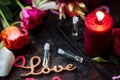 Flaming candle and perfume in glass bottles. Royalty Free Stock Photo