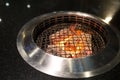 Flaming charcoal barbecue grill, ready for raw meat BBQ or yakiniku, food and restaurant concept